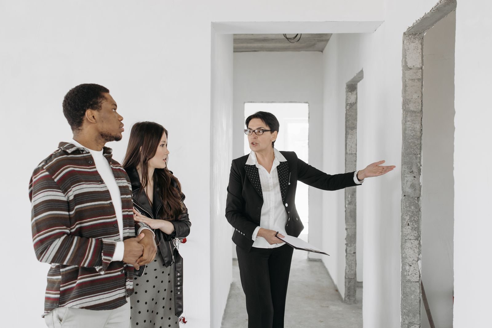 An estate agent showing an apartment to a couple